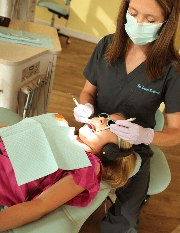 Pediatric Dentist, Dr. Laura With Patient